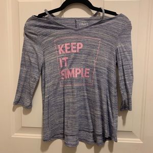 Blueish gray long sleeve with off the shoulder design and pink writing.